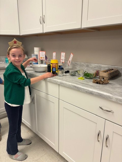 A child engaged in a practical-life activity